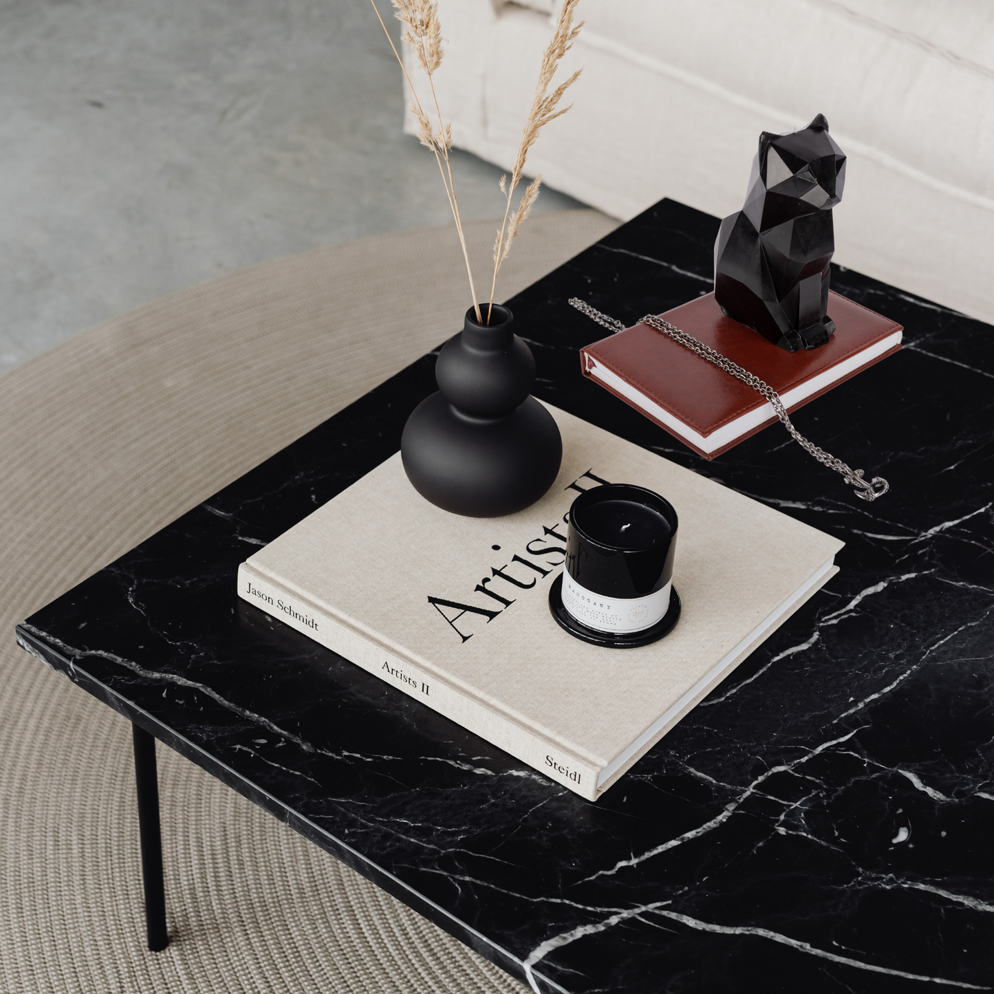 Black cat candle on a wooden table, top view – gothic home decor for cat lovers