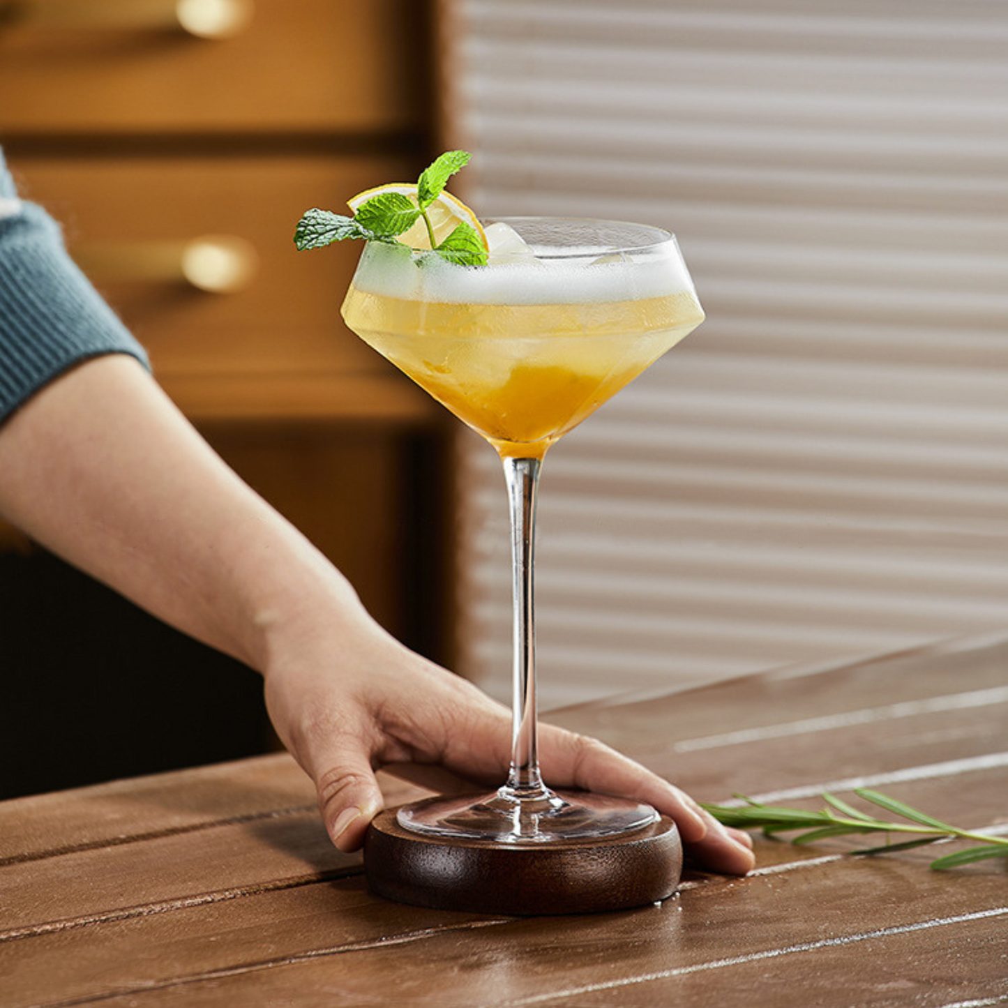 Close-up of hand-blown crystal martini glass with cocktail
