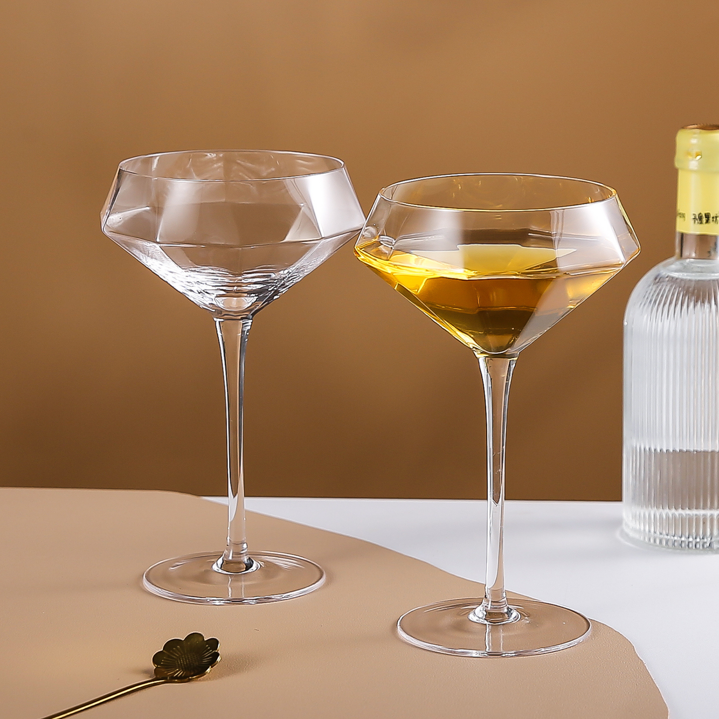 Cocktail preparation scene with tall martini glasses