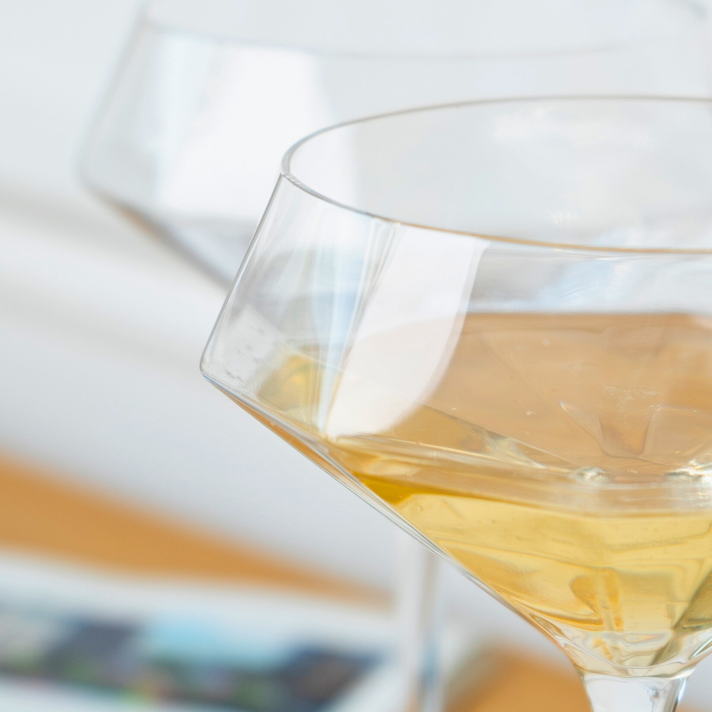 Close-up of diamond-shaped martini glass showcasing faceted design