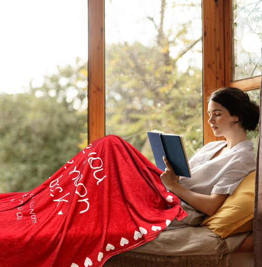 Young woman relaxing with a cozy fleece throw – a thoughtful cute gift for men, gifts for young women, and thinking of you gifts.