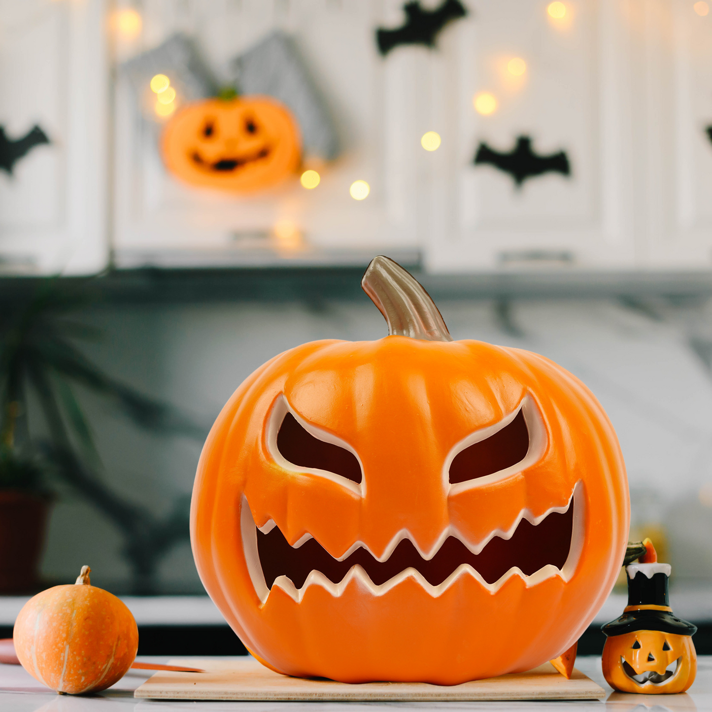 Close-up of detailed Halloween pumpkin face – jack o lantern table decor