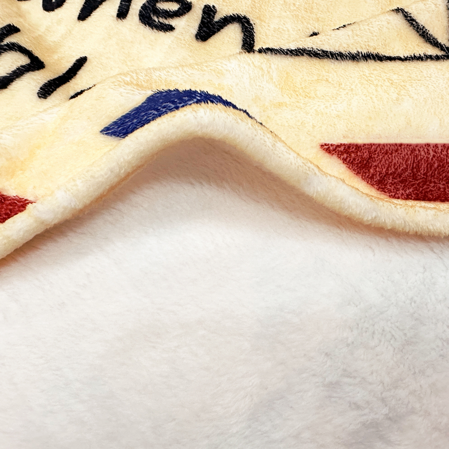 beige fluffy blanket with soft material close up