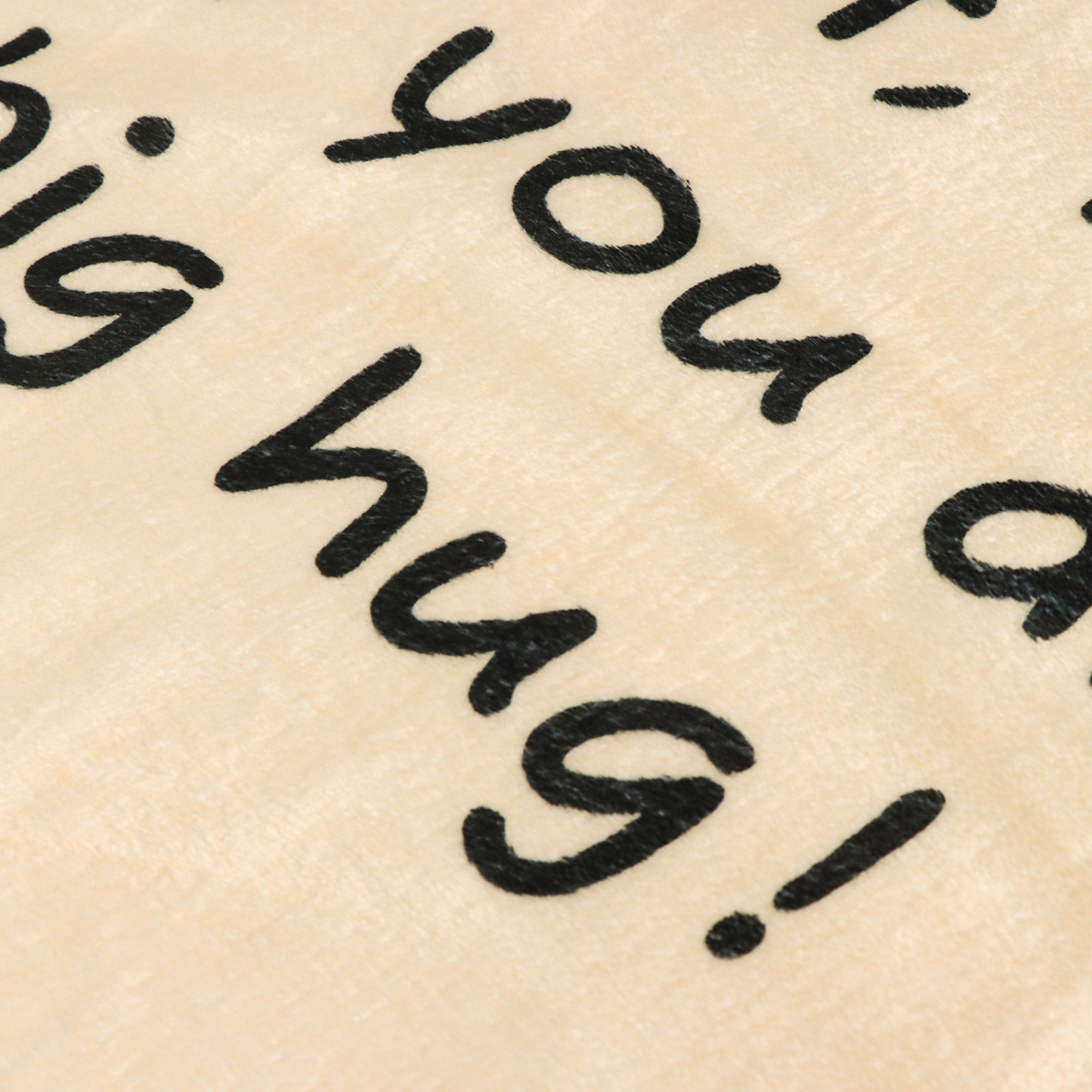 warm beige blanket with words close up