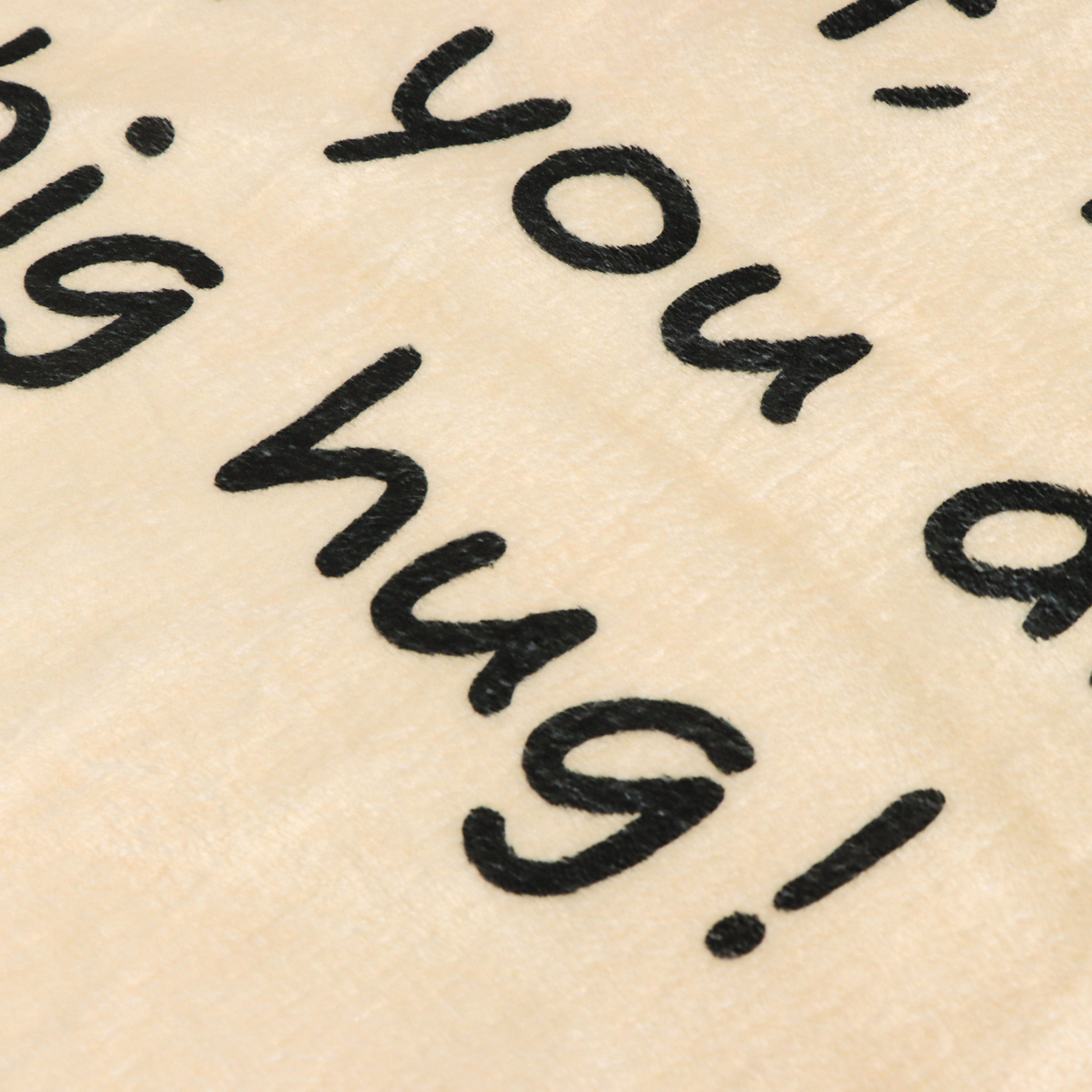 warm beige blanket with words close up