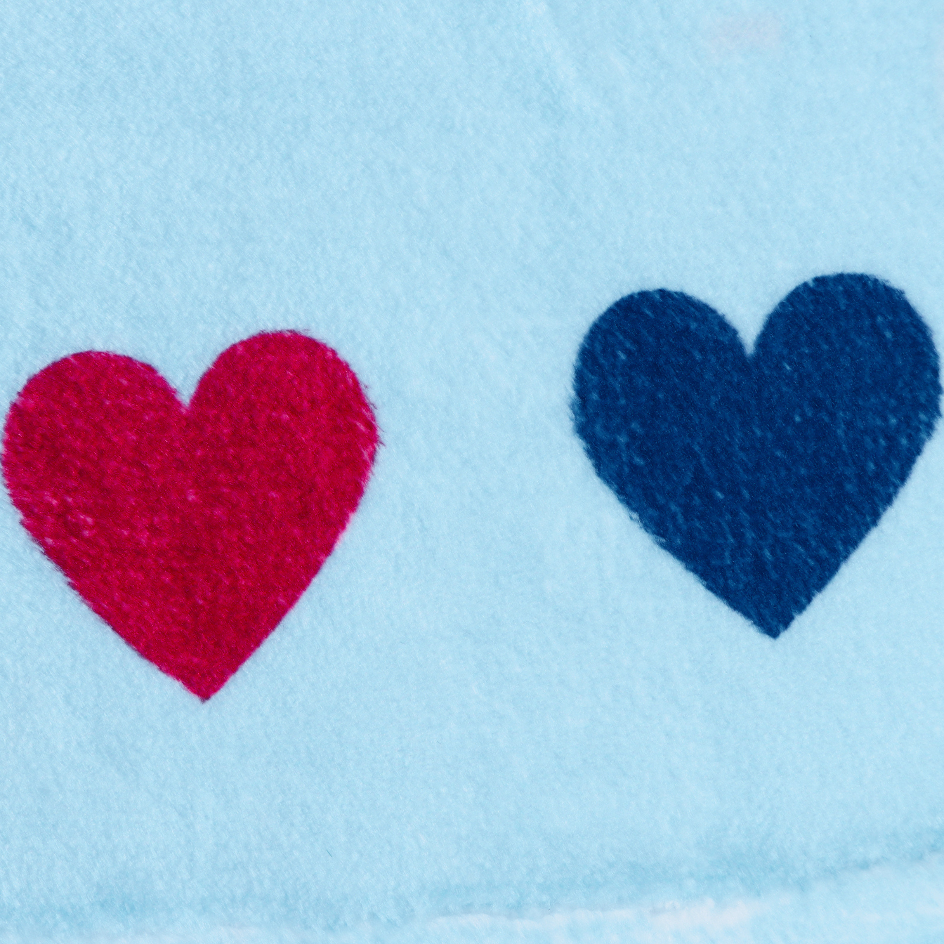 warm blue blanket with hearts close up