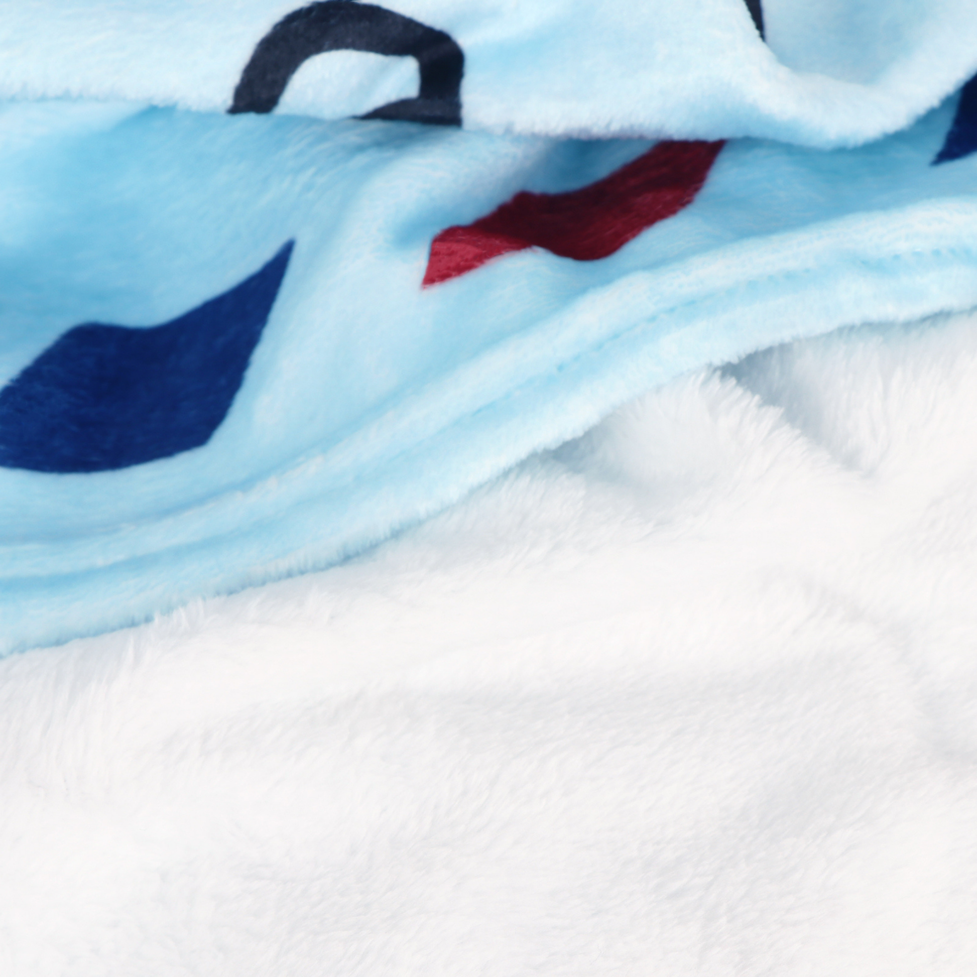 blue fluffy blanket with soft material close up