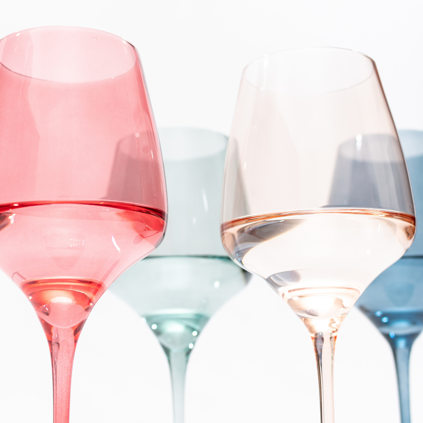 Designer set of four colored wine glasses, featuring unique patterns and hues