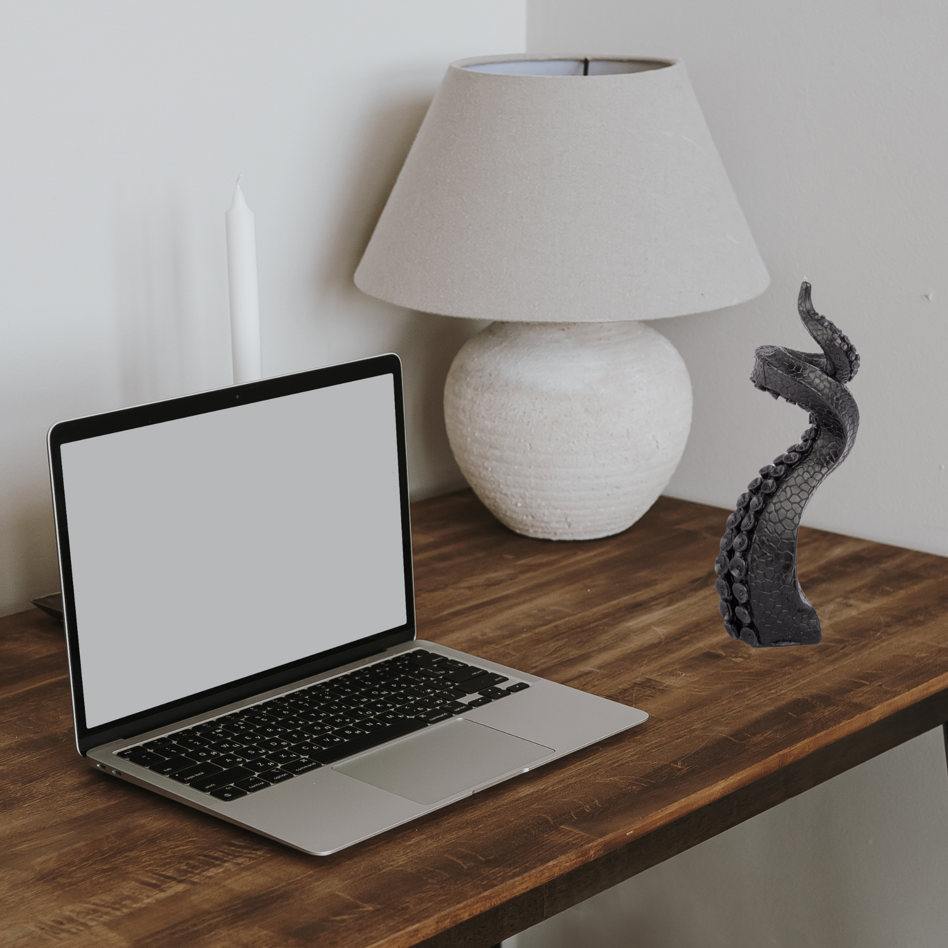 Tentacle-shaped candle near laptop – fun gift for fans of weird decor or ocean-inspired style