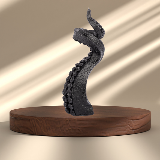Black tentacle candle on a display pedestal – warm gothic decor with soft light and sculptural style