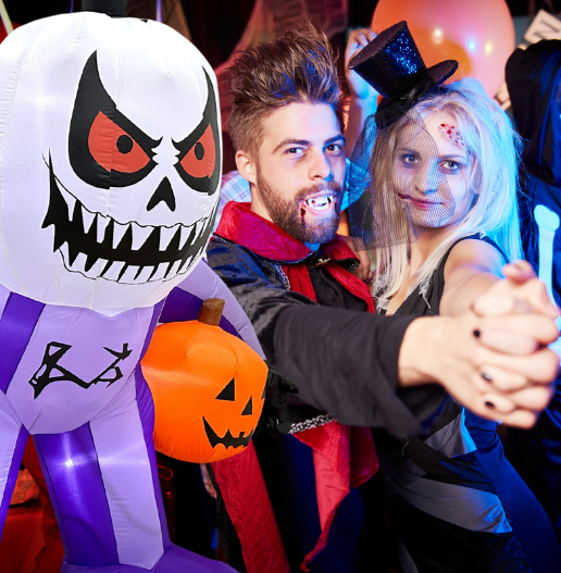 Mystic Moon Jack glowing indoors as centerpiece at a Halloween party with spooky decorations