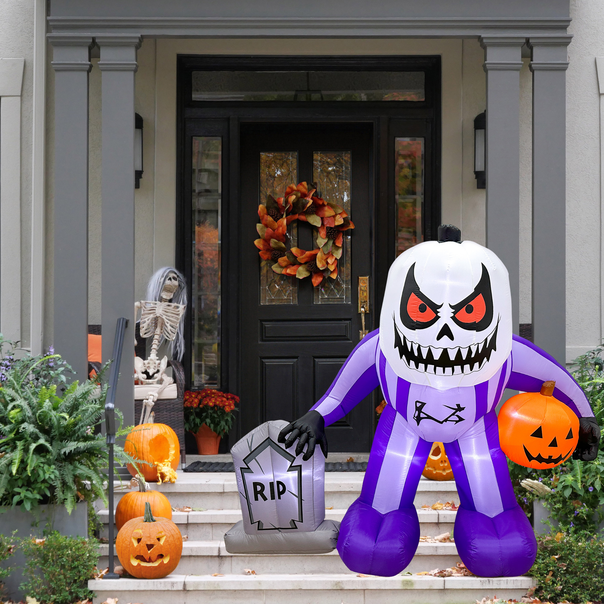 Mystic Moon Jack on front porch in daylight, part of outdoor Halloween yard decor setup