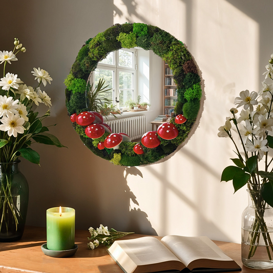 Close-up of cute mushroom mirror beside flowers, candle, and book – rustic room decor