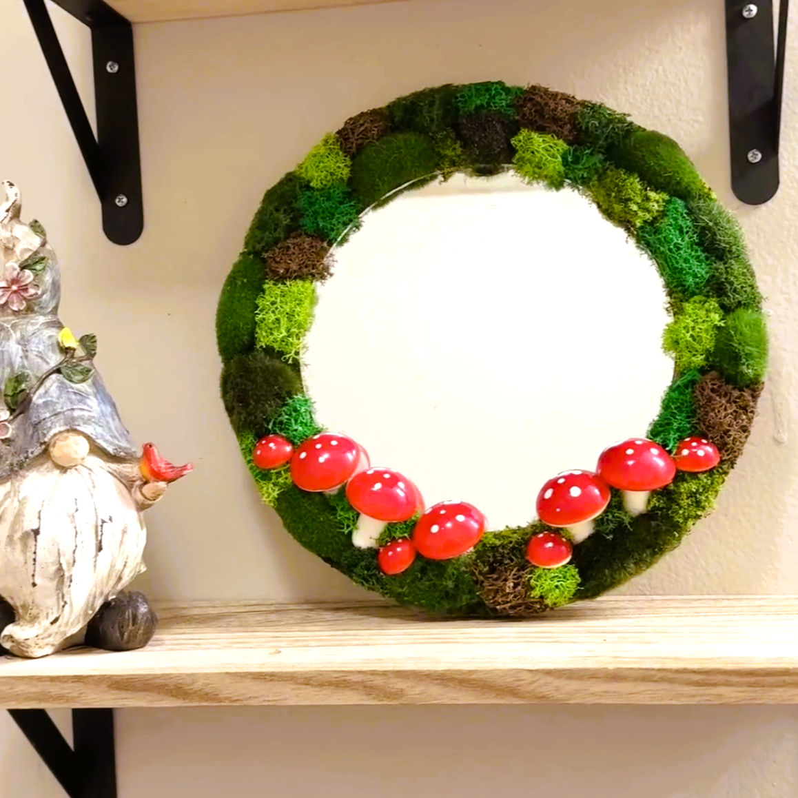 Decorative mirror with preserved moss on display shelf – cozy nursery or living room decor