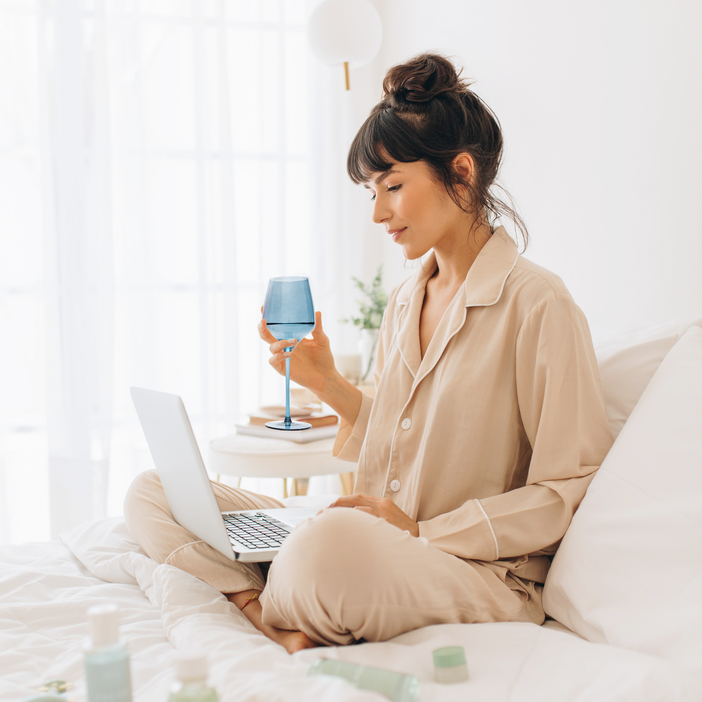 Vibrant and festive blue wine glass with a unique charm